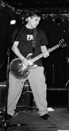 Tom strumming in b+w at Kennys Castaways - 1/7/03